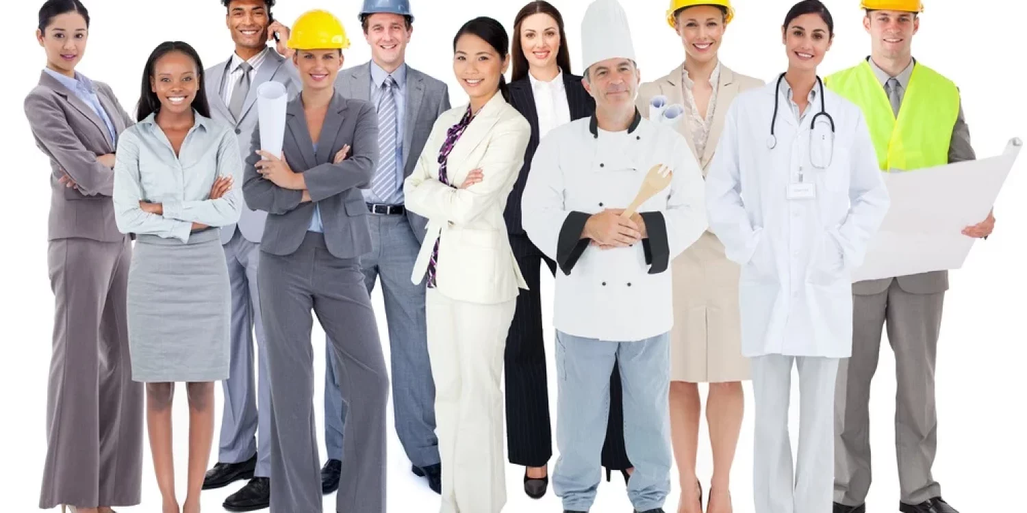 Diverse group of workers standing against white background